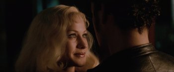 Movie still from “Lost Highway” (1997), directed by David Lynch – A person with blonde hair; Close Up shot, Over the shoulder angle