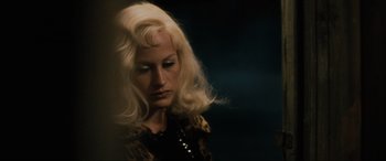 Movie still from “Lost Highway” (1997), directed by David Lynch – A woman with blonde hair is looking at the camera; Close Up shot, Over the shoulder angle