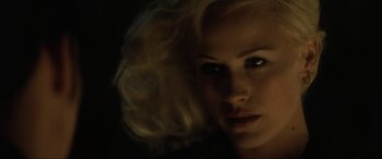 Movie still from “Lost Highway” (1997), directed by David Lynch – A person with blonde hair; Close Up shot, Over the shoulder angle
