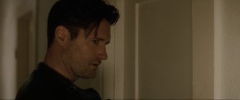 Movie still from “Lost Highway” (1997), directed by David Lynch – A person looking at a mirror; Close Up shot, Over the shoulder angle