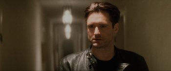 Movie still from “Lost Highway” (1997), directed by David Lynch – A person wearing a leather jacket; Close Up shot, Low angle