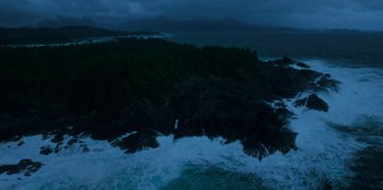 Movie still from “Lou” (2022), directed by Anna Foerster – A body of water near a body of water at night time; Extreme Wide shot, High angle