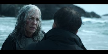 Movie still from “Lou” (2022), directed by Anna Foerster – An older woman and a younger man in the water; Close Up shot, Over the shoulder angle