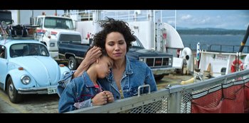 Movie still from “Lou” (2022), directed by Anna Foerster – A woman and a child are standing next to each other; Medium shot, Low angle