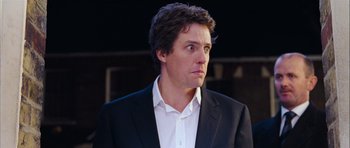 Movie still from “Love Actually” (2003), directed by Richard Curtis – Close Up shot, Over the shoulder angle