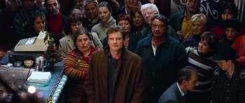 Movie still from “Love Actually” (2003), directed by Richard Curtis – Medium shot, High angle