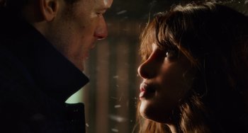 Movie still from “Love Again” (2023), directed by Jim Strouse – Two people looking at each other; Close Up shot, Over the shoulder angle