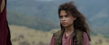 Movie still from “Love and Monsters” (2020), directed by Michael Matthews – A young girl is looking into the distance; Close Up shot, Over the shoulder angle