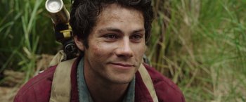 Movie still from “Love and Monsters” (2020), directed by Michael Matthews – A person wearing a jacket; Close Up shot, Over the shoulder angle