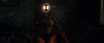 Movie still from “Love and Monsters” (2020), directed by Michael Matthews – An image of a robot with a glowing face; Wide shot, High angle