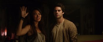 Movie still from “Love and Monsters” (2020), directed by Michael Matthews – A man and a woman standing next to each other; Medium shot, Low angle