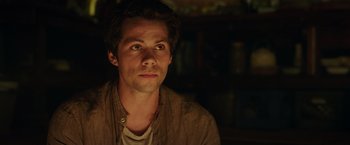 Movie still from “Love and Monsters” (2020), directed by Michael Matthews – A young man is looking into the distance; Close Up shot, Low angle