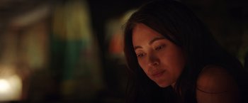 Movie still from “Love and Monsters” (2020), directed by Michael Matthews – A person with long dark hair; Close Up shot, Over the shoulder angle