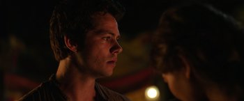 Movie still from “Love and Monsters” (2020), directed by Michael Matthews – A young man looking into the distance in the dark; Close Up shot, Over the shoulder angle