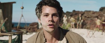 Movie still from “Love and Monsters” (2020), directed by Michael Matthews – A person wearing a brown shirt; Close Up shot, Over the shoulder angle