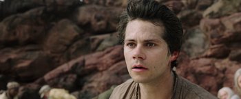 Movie still from “Love and Monsters” (2020), directed by Michael Matthews – A young man is looking into the distance; Close Up shot, Low angle