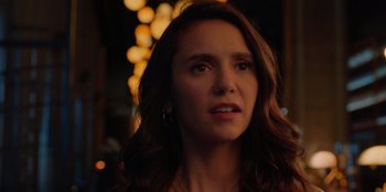 Movie still from “Love Hard” (2021), directed by Hernán Jiménez – A person with long brown hair; Close Up shot, Over the shoulder angle