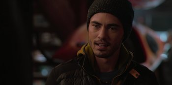 Movie still from “Love Hard” (2021), directed by Hernán Jiménez – A person wearing a jacket and a hat; Close Up shot, Over the shoulder angle