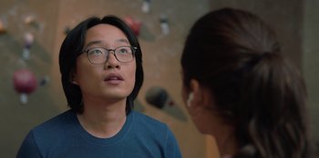 Movie still from “Love Hard” (2021), directed by Hernán Jiménez – A man and a woman are looking at one another; Close Up shot, Over the shoulder angle