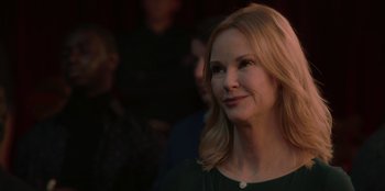 Movie still from “Love Hard” (2021), directed by Hernán Jiménez – A person wearing a black shirt; Close Up shot, Over the shoulder angle