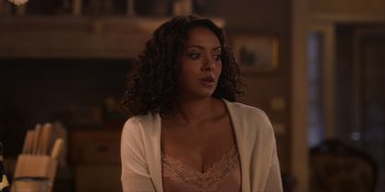 Movie still from “Love in the Villa” (2022), directed by Mark Steven Johnson – A woman in a bra and a white jacket; Close Up shot, Over the shoulder angle