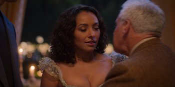 Movie still from “Love in the Villa” (2022), directed by Mark Steven Johnson – A woman in a dress is talking to an older man; Close Up shot, Over the shoulder angle