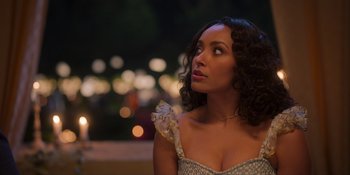 Movie still from “Love in the Villa” (2022), directed by Mark Steven Johnson – A woman in a dress looking to her left; Close Up shot, Over the shoulder angle