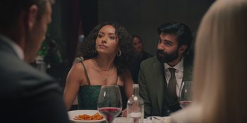 Movie still from “Love in the Villa” (2022), directed by Mark Steven Johnson – A man and a woman sitting at a dinner table; Medium shot, Over the shoulder angle