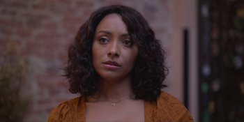 Movie still from “Love in the Villa” (2022), directed by Mark Steven Johnson – A person wearing a brown shirt; Close Up shot, Over the shoulder angle