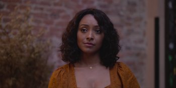 Movie still from “Love in the Villa” (2022), directed by Mark Steven Johnson – A person wearing a brown shirt; Close Up shot, Over the shoulder angle