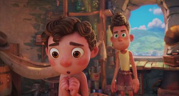 Movie still from “Luca” (2021), directed by Enrico Casarosa – A boy and a boy are standing next to each other in a room; Medium shot, Over the shoulder angle