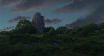 Movie still from “Luca” (2021), directed by Enrico Casarosa – A dark sky with a castle like tower in the middle of a field; Extreme Wide shot, Low angle