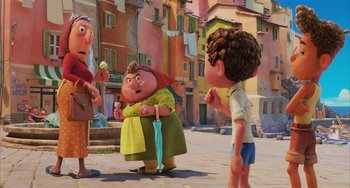 Movie still from “Luca” (2021), directed by Enrico Casarosa – A group of people standing next to each other on a street; Wide shot, Over the shoulder angle