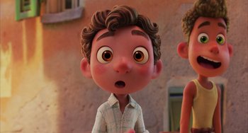 Movie still from “Luca” (2021), directed by Enrico Casarosa – A cartoon of a boy with a surprised look on his face; Close Up shot, Over the shoulder angle