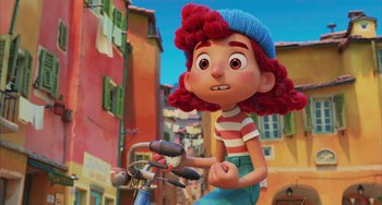 Movie still from “Luca” (2021), directed by Enrico Casarosa – A cartoon girl riding a bike down a street; Wide shot, Low angle