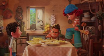 Movie still from “Luca” (2021), directed by Enrico Casarosa – Two people sitting at a table with a plate of food; Wide shot, Low angle