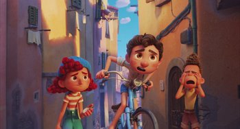 Movie still from “Luca” (2021), directed by Enrico Casarosa – A couple of people that are on a bike; Wide shot, Low angle