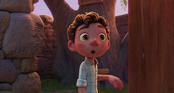Movie still from “Luca” (2021), directed by Enrico Casarosa – A cartoon of a boy with a surprised look on his face; Medium shot, Over the shoulder angle