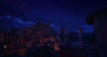 Movie still from “Luca” (2021), directed by Enrico Casarosa – Two people looking at the sky at night from a balcony; Extreme Wide shot, High angle