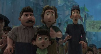 Movie still from “Luca” (2021), directed by Enrico Casarosa – A group of people standing next to each other in front of a building; Medium shot, Low angle