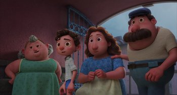 Movie still from “Luca” (2021), directed by Enrico Casarosa – A group of people standing next to each other in a room; Medium shot, Low angle