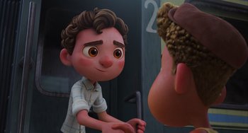 Movie still from “Luca” (2021), directed by Enrico Casarosa – A cartoon of a young boy and a young man; Medium shot, Over the shoulder angle