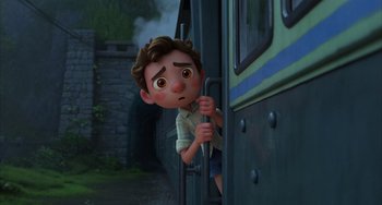 Movie still from “Luca” (2021), directed by Enrico Casarosa – A boy is looking out of a train window; Medium shot, Low angle
