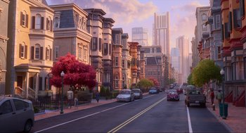 Movie still from “Luck” (2022), directed by Peggy Holmes – A street scene with cars parked on the side of the road; Extreme Wide shot, High angle