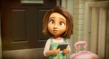 Movie still from “Luck” (2022), directed by Peggy Holmes – A girl is holding a tablet in her hands; Close Up shot, Over the shoulder angle