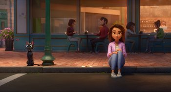 Movie still from “Luck” (2022), directed by Peggy Holmes – A girl sitting on the ground in front of a building; Wide shot, Over the shoulder angle