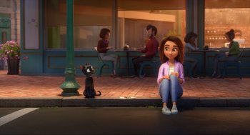 Movie still from “Luck” (2022), directed by Peggy Holmes – A woman sitting on the ground next to a black cat; Wide shot, Over the shoulder angle