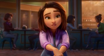 Movie still from “Luck” (2022), directed by Peggy Holmes – A young girl sitting on the ground in a room; Close Up shot, Over the shoulder angle