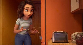 Movie still from “Luck” (2022), directed by Peggy Holmes – A woman standing in front of a toaster in a room; Medium shot, Over the shoulder angle