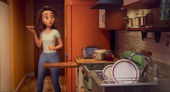 Movie still from “Luck” (2022), directed by Peggy Holmes – A woman standing in front of an oven holding a wooden board; Medium shot, Over the shoulder angle